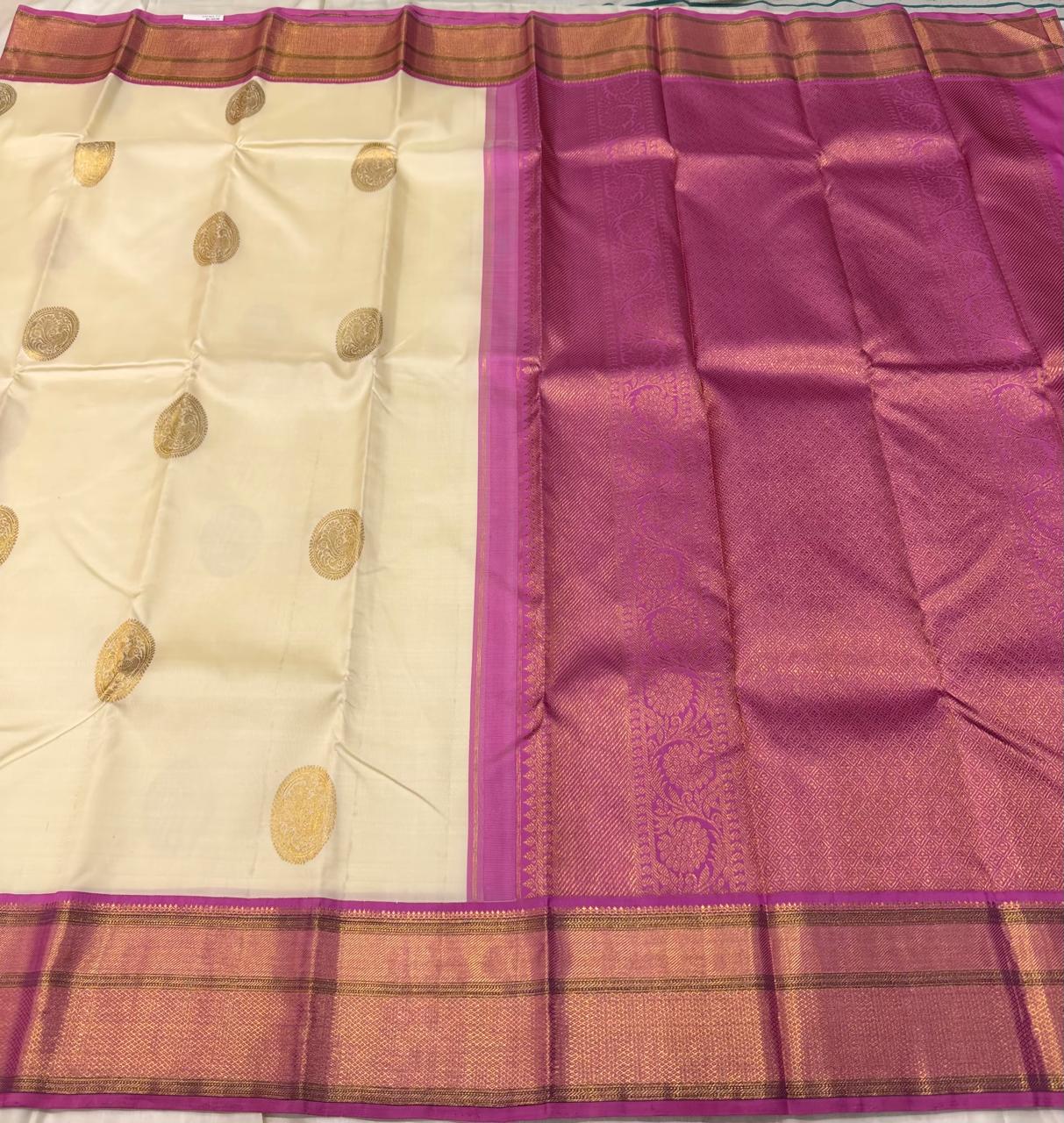 Bridal pure silk saree with circular zari motifs and magenta pallu