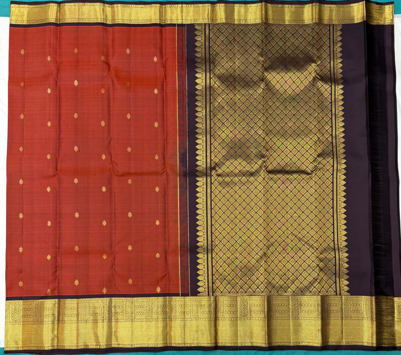 Rust orange Kanchipuram silk saree with maroon zari border – full view

