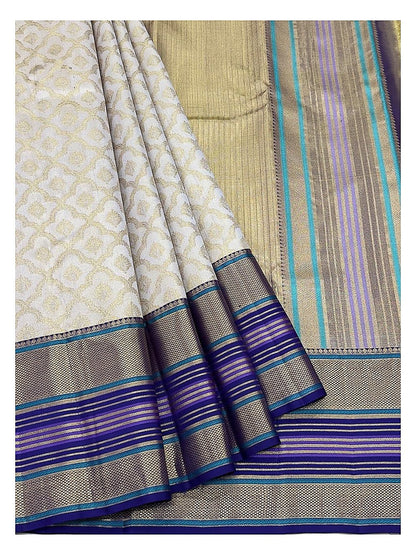 Soft Ivory Handwoven Kanchipuram Silk Saree with Gold Floral Motifs and Blue Purple Contrast Pallu front view