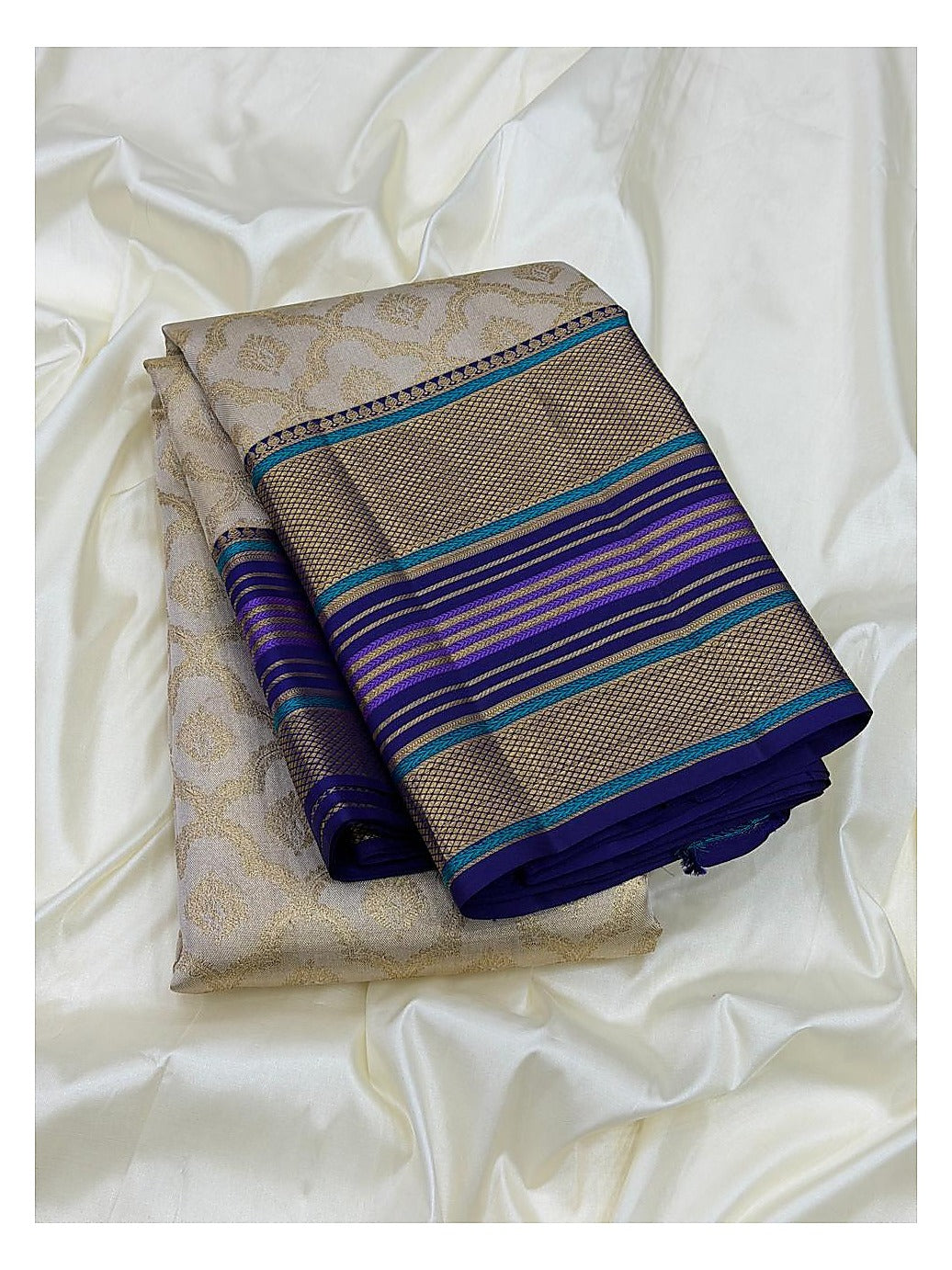 Soft Ivory Handwoven Kanchipuram Silk Saree with Gold Floral Motifs and Blue Purple Contrast Pallu