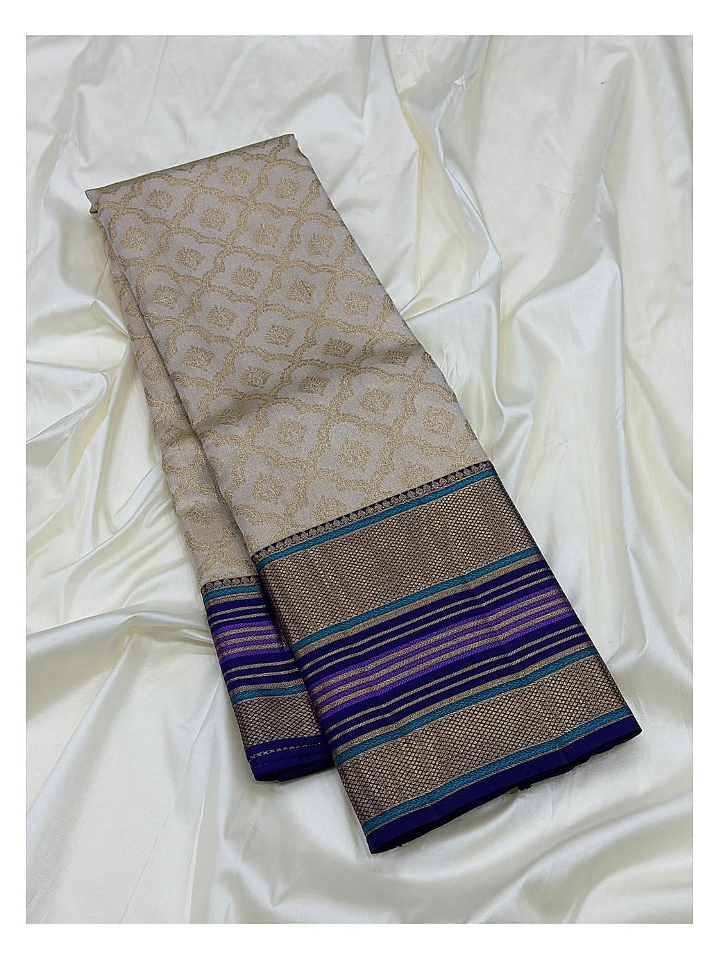 Soft Ivory Handwoven Kanchipuram Silk Saree with Gold Floral Motifs and Blue Purple Contrast Pallu