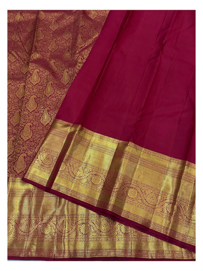 Wine Kanchipuram silk saree with broad rich gold woven border and matching blouse piece