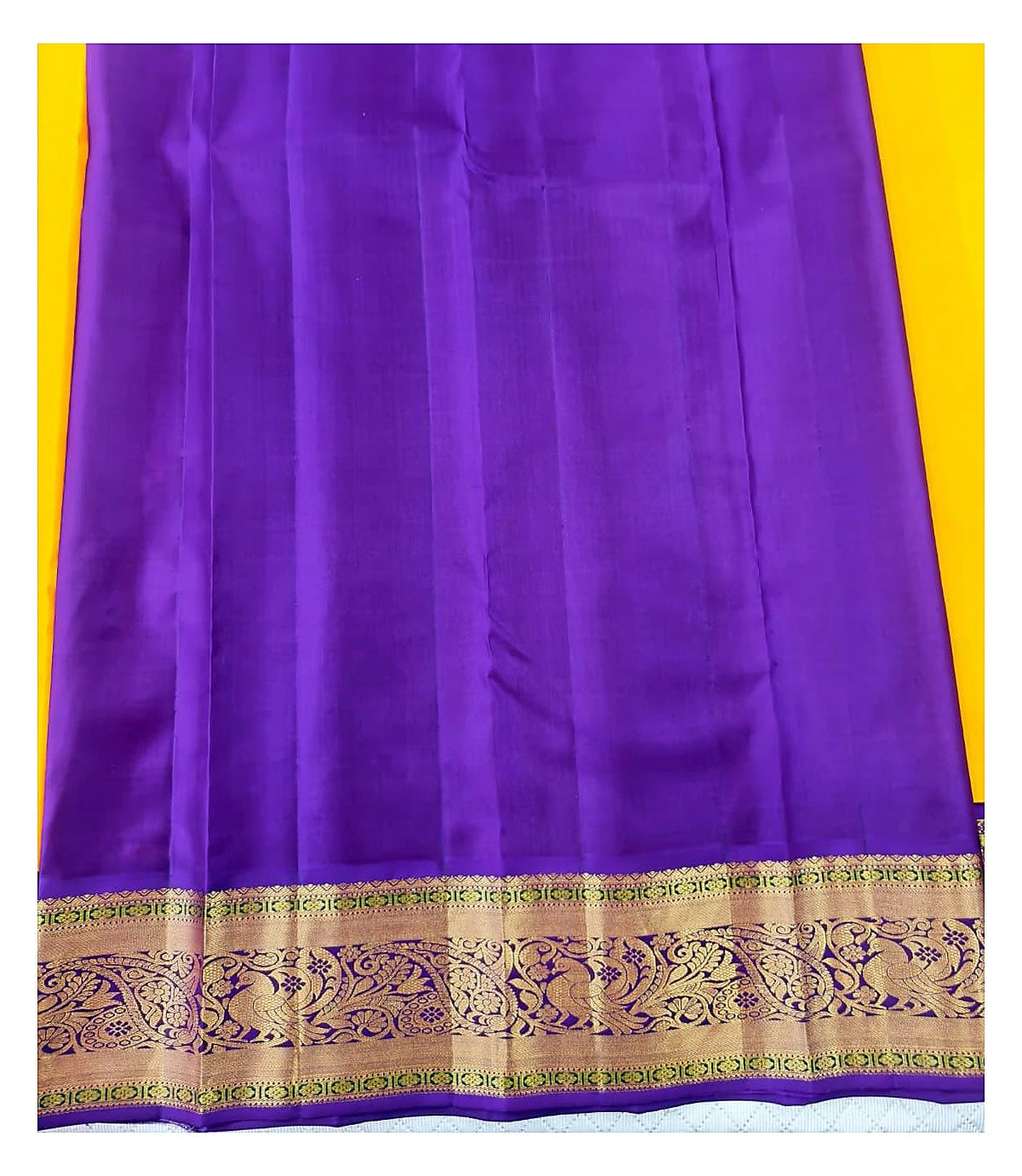 Yellow Handwoven Kanchipuram Silk Saree with Purple Contrast Pallu and Broad Peacock Border front view